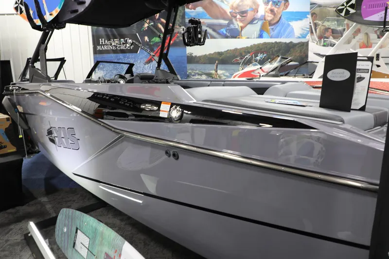 Slide: The Image of 2024 Axis T250 boat displayed at a marine exhibition, showcasing sleek design and modern features. - 8
