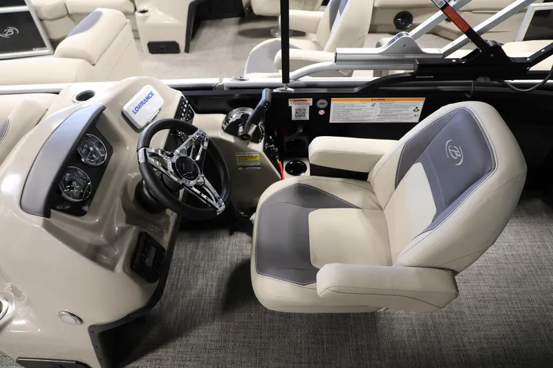 Slide: The Image of 2024 Barletta ARIA A20QC boat interior with steering wheel and captain's chair. - 12
