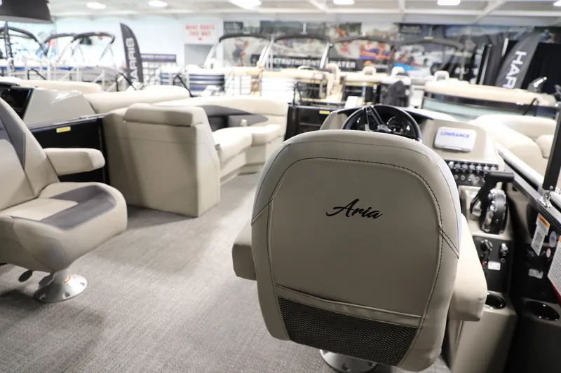 Slide: The Image of 2024 Barletta ARIA A20QC boat interior with luxurious seating and modern dashboard. - 8