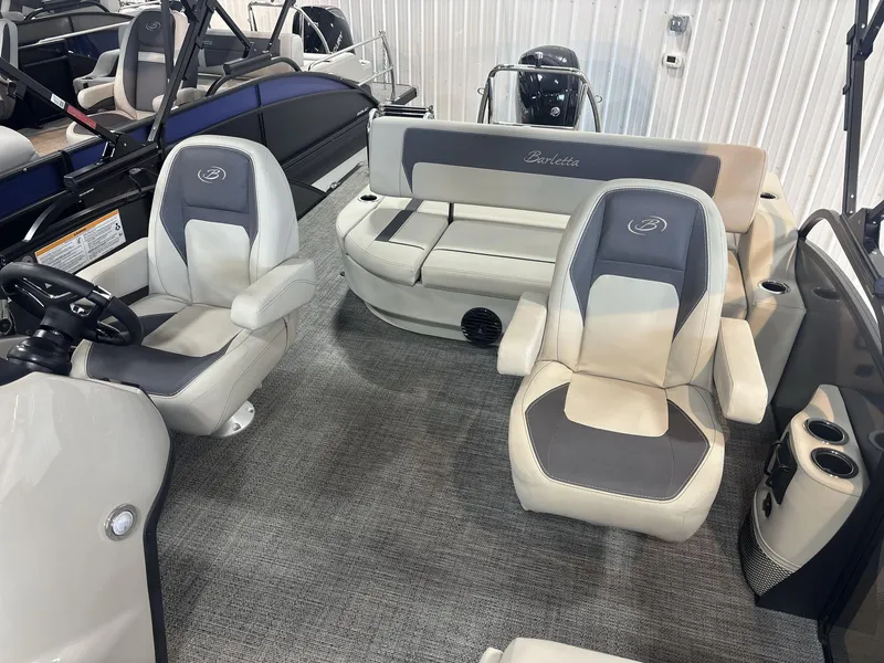 Slide: The Image of 2024 Barletta ARIA 20UC pontoon boat interior with plush seating and modern design. - 10