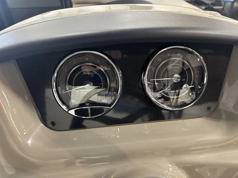 Slide: The Image of 2024 Barletta ARIA 20UC dashboard with RPM and MPH gauges. - 14