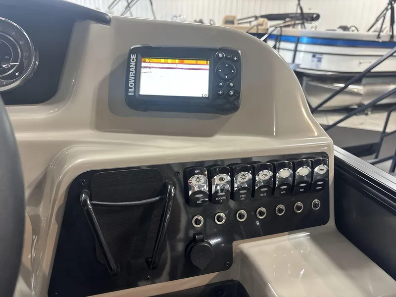 Slide: The Image of 2024 Barletta ARIA 20UC dashboard with Lowrance display and control panel. - 15