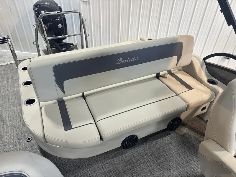 Slide: The Image of 2024 Barletta ARIA 20UC boat interior with beige seating and cup holders. - 17