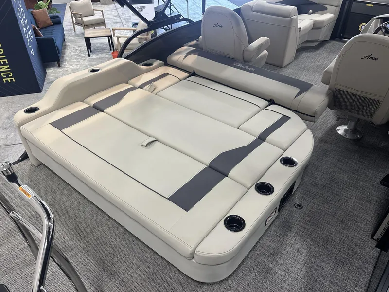 Slide: The Image of 2024 Barletta ARIA 20UC pontoon boat interior with luxurious seating and cup holders. - 19