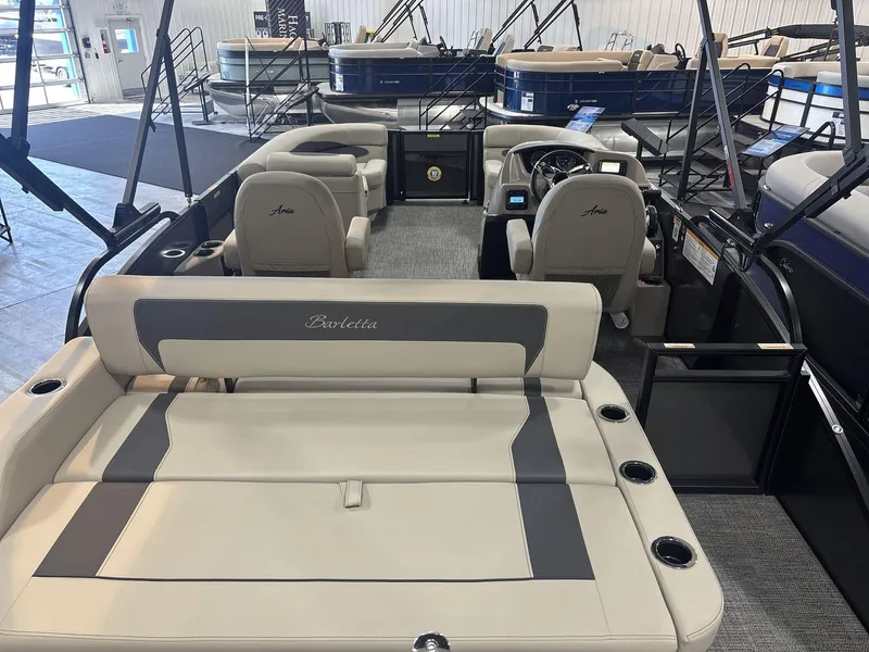 Slide: The Image of 2024 Barletta ARIA 20UC pontoon boat interior with luxurious seating and modern design. - 6