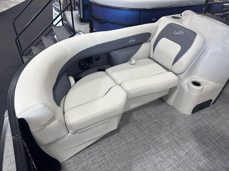 Slide: The Image of 2024 Barletta ARIA 20UC boat interior with plush seating and cup holders. - 9