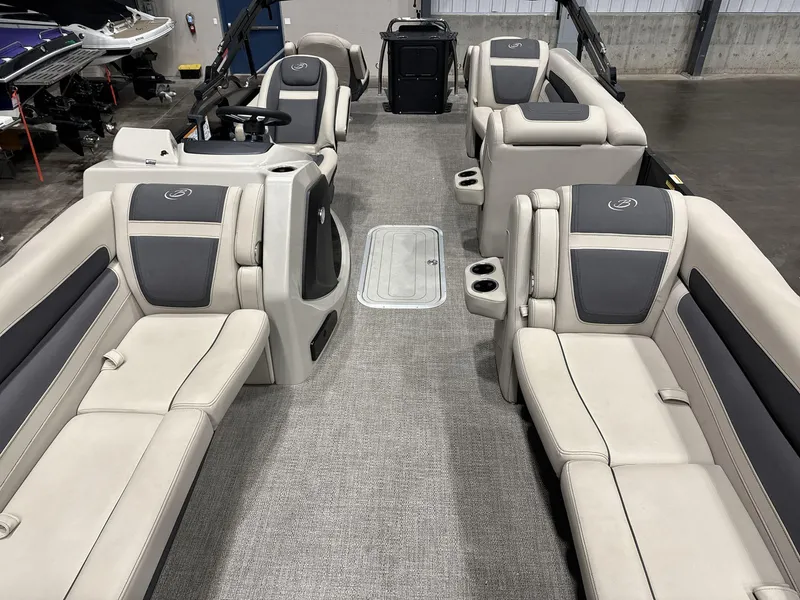 Slide: The Image of 2023 Barletta C24CC pontoon boat interior with plush seating and modern design. - 10