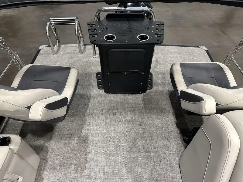 Slide: The Image of 2023 Barletta C24CC boat interior with seating and control console. - 12