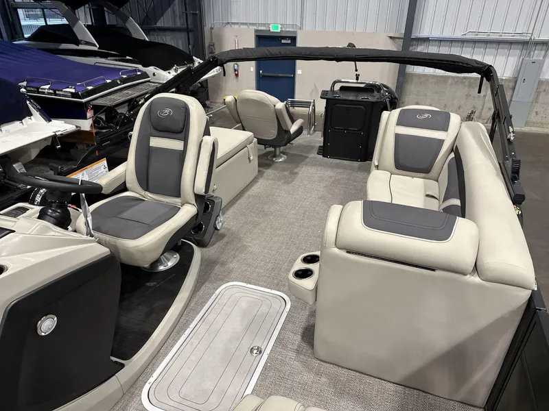 Slide: The Image of 2023 Barletta C24CC boat interior with plush seating and modern design. - 14