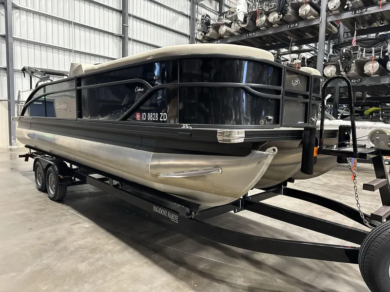 Slide: The Image of 2023 Barletta C24CC pontoon boat on trailer in storage facility. - 4