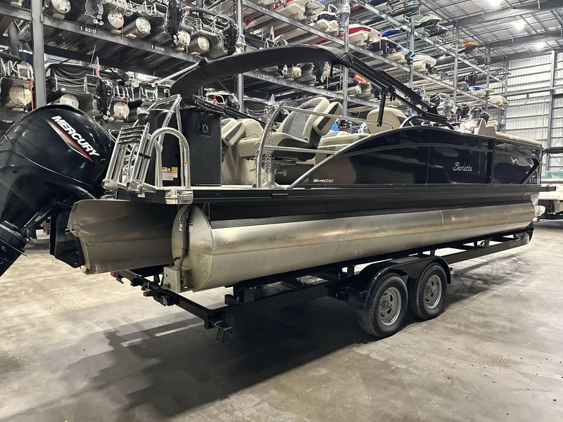 Slide: The Image of 2023 Barletta C24CC pontoon boat on trailer in storage facility. - 5