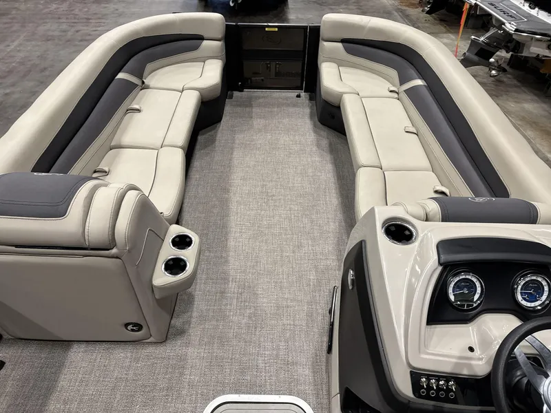 Slide: The Image of 2023 Barletta C24CC pontoon boat interior with plush seating and modern dashboard. - 9