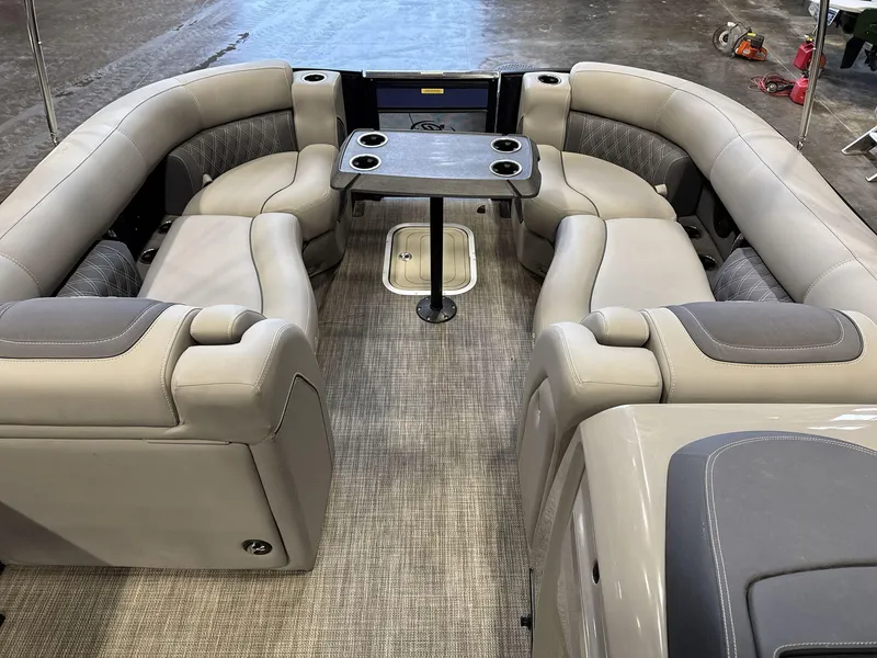 Slide: The Image of 2023 Barletta Lusso 25MA interior with luxurious seating and table setup. - 8