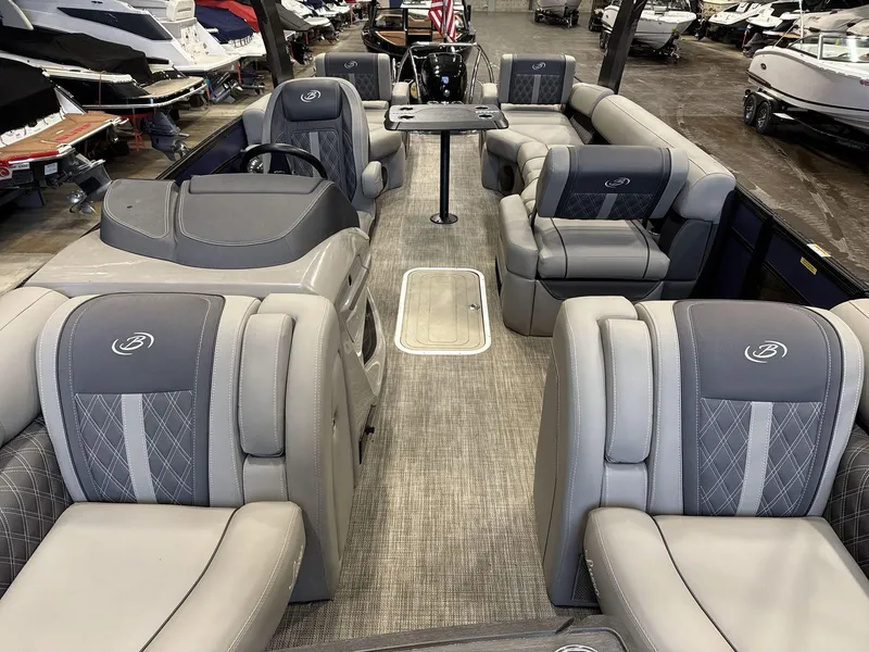 Slide: The Image of 2023 Barletta Lusso 25MA pontoon boat interior with luxurious gray seating and modern design. - 9