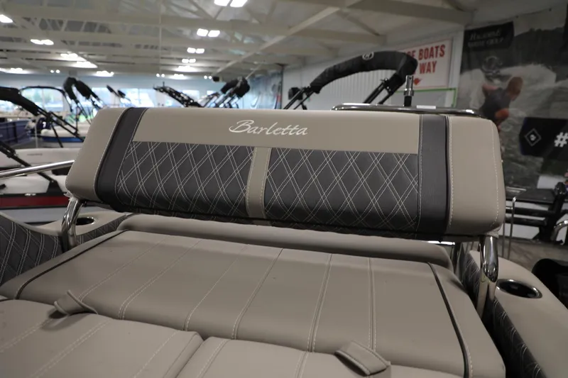 Slide: The Image of 2023 Barletta L25UEA boat interior with luxurious seating and elegant stitching. - 18