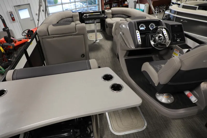 Slide: The Image of 2023 Barletta L25UEA pontoon boat interior with modern helm and seating. - 21
