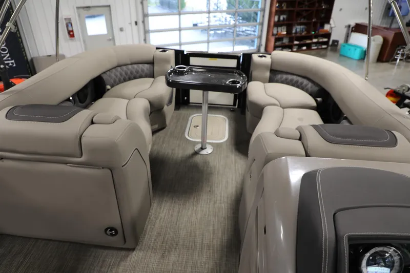 Slide: The Image of 2023 Barletta L25UEA pontoon boat interior with luxurious seating and table. - 3