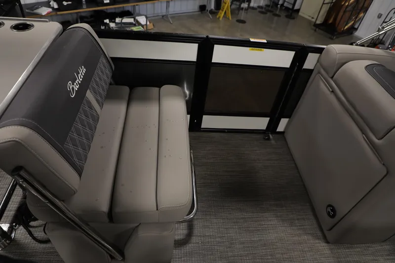 Slide: The Image of 2023 Barletta L25UEA boat interior with gray seating and modern design. - 6
