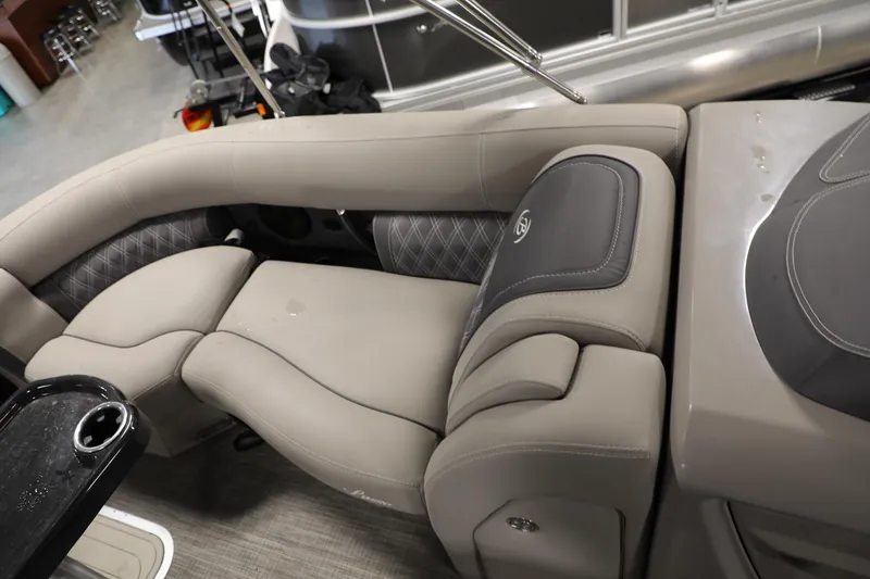 Slide: The Image of 2023 Barletta L25UEA pontoon boat interior with luxurious beige seating and cup holder. - 9