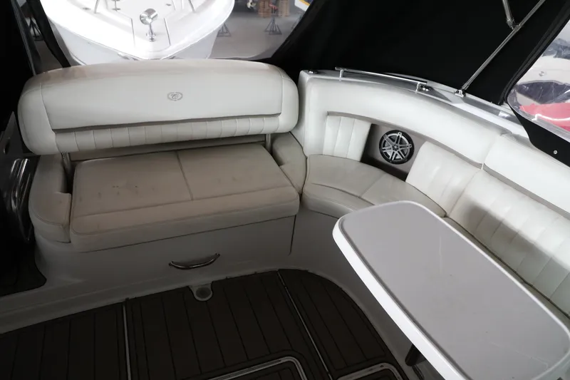 Slide: The Image of Interior seating area of a 2006 Cobalt 323 boat with white leather upholstery. - 8