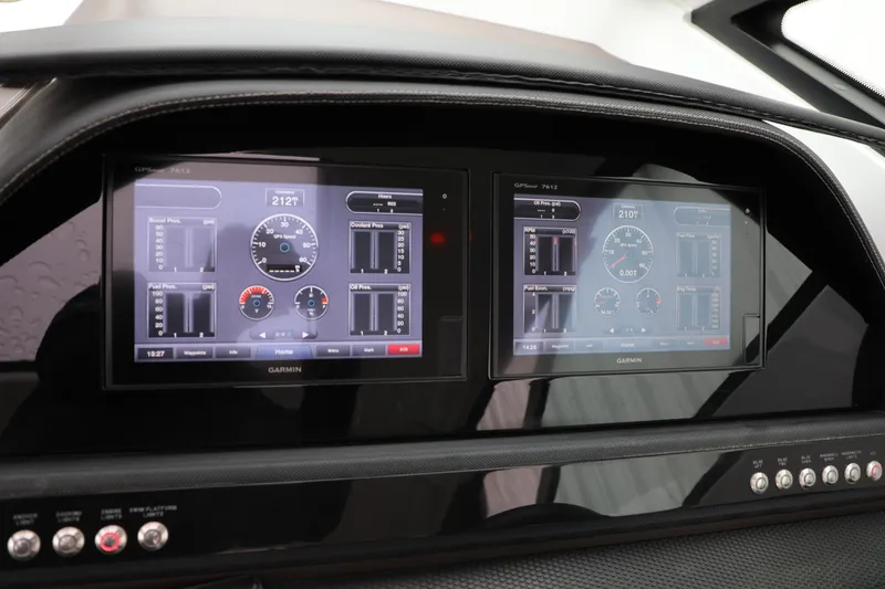 Slide: The Image of Dual Garmin displays on the dashboard of a 2016 Cobalt A40 boat. - 15