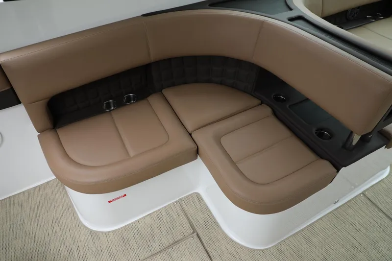 Slide: The Image of 2016 Cobalt A40 boat interior with tan leather seating and cup holders. - 5
