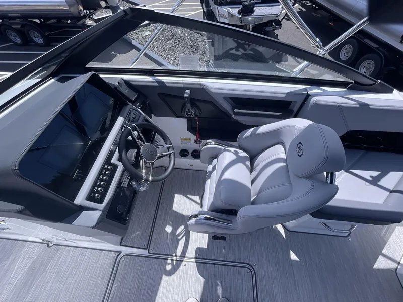 Slide: The Image of 2024 Cobalt R4 boat interior with modern dashboard and comfortable seating. - 11