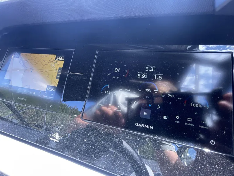 Slide: The Image of 2024 Cobalt R4 dashboard with Garmin navigation and digital display screens. - 13