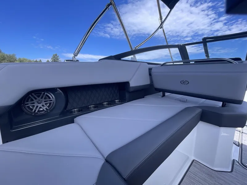 Slide: The Image of 2024 Cobalt R4 boat interior with luxurious seating and built-in speaker. - 16
