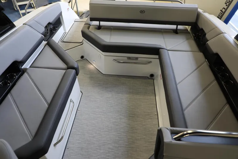 Slide: The Image of 2024 Cobalt R8 boat interior with luxurious gray seating and modern design. - 11