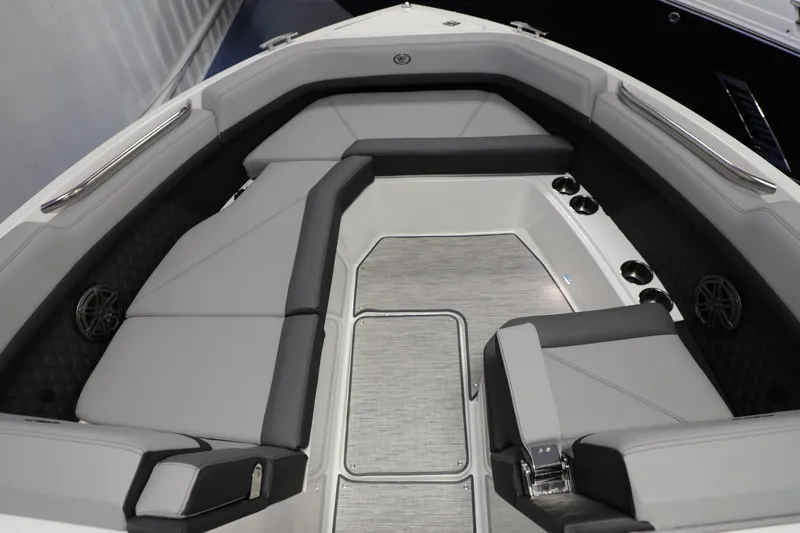 Slide: The Image of 2024 Cobalt R8 boat interior with gray seating and cup holders. - 3