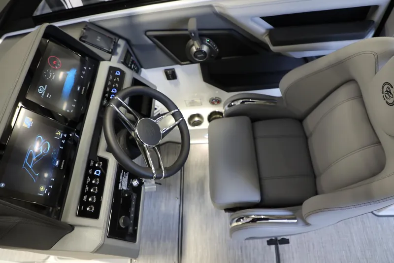 Slide: The Image of 2024 Cobalt R8 boat cockpit with modern steering wheel and dual digital displays. - 6