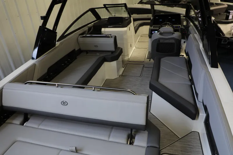 Slide: The Image of 2024 Cobalt R8 boat interior with luxurious seating and modern dashboard. - 7