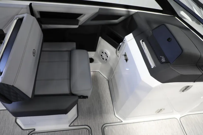 Slide: The Image of 2024 Cobalt R8 boat interior with gray seating and modern dashboard. - 9