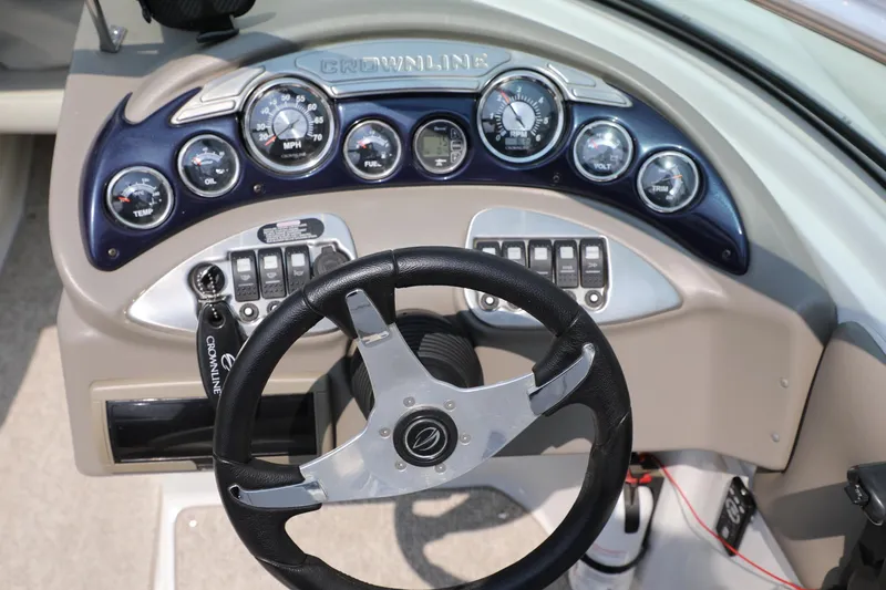 Slide: The Image of Dashboard of 2010 Crownline 220 LS boat with steering wheel and gauges. - 12