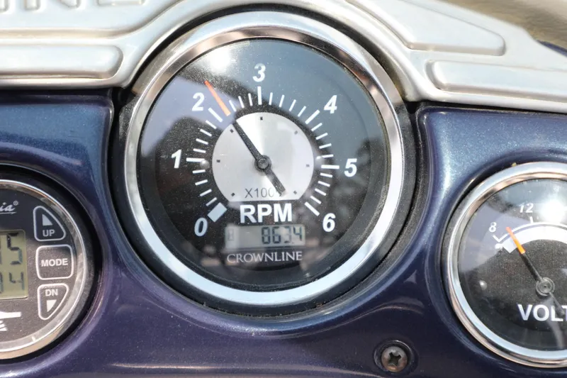 Slide: The Image of Close-up of 2010 Crownline 220 LS boat RPM gauge displaying 863.4 hours. - 13
