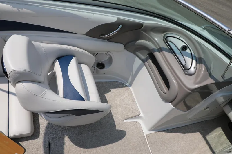 Slide: The Image of Interior of 2010 Crownline 220 LS boat, featuring sleek seating and modern design. - 4