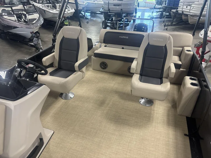 Slide: The Image of 2024 Harris Cruiser 210 boat interior with plush seating and modern design. - 11