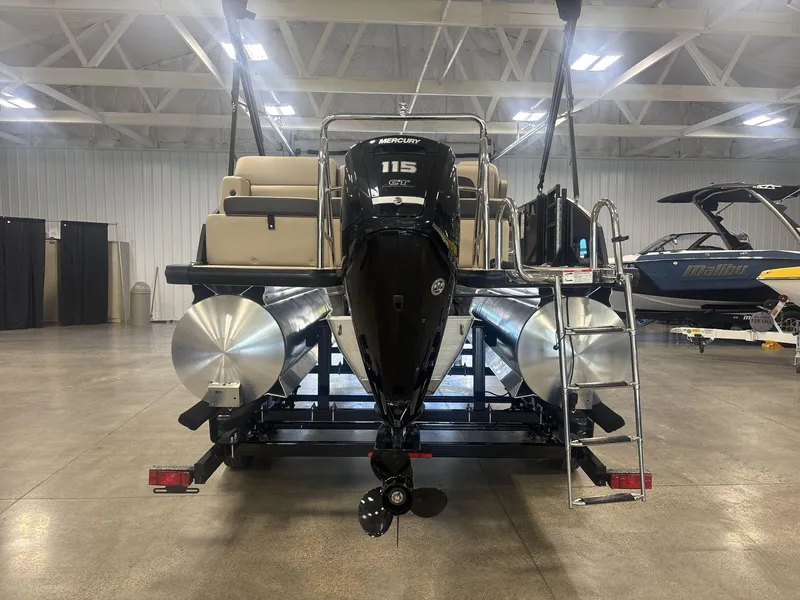 Slide: The Image of 2024 Harris Cruiser 210 pontoon boat with Mercury engine in showroom. - 6