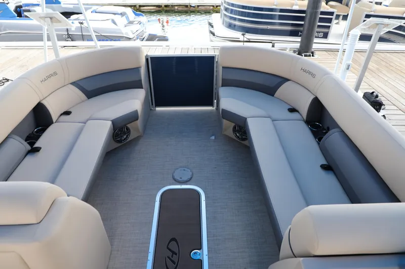 Slide: The Image of 2023 Harris Cruiser 230 boat interior with spacious seating and modern design. - 3