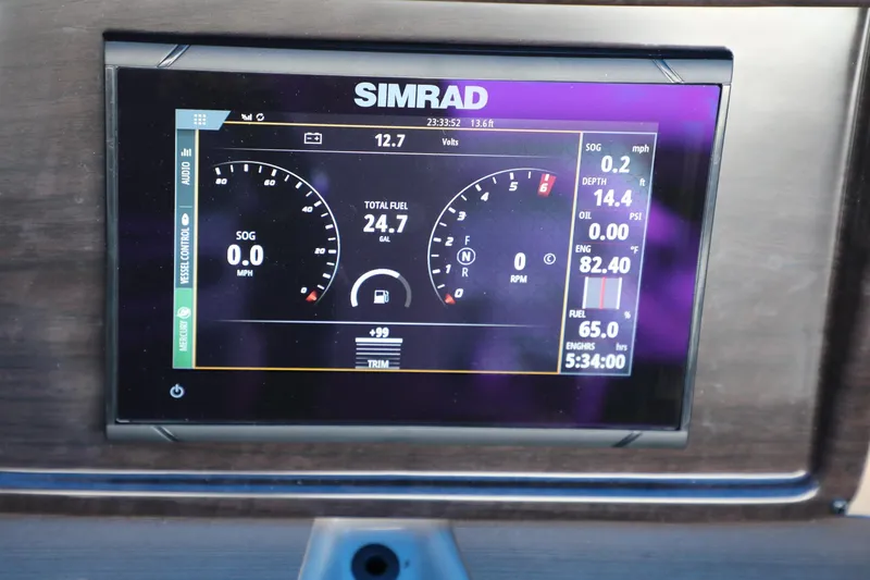 Slide: The Image of Simrad display on 2023 Harris Cruiser 230 showing fuel and engine data. - 4