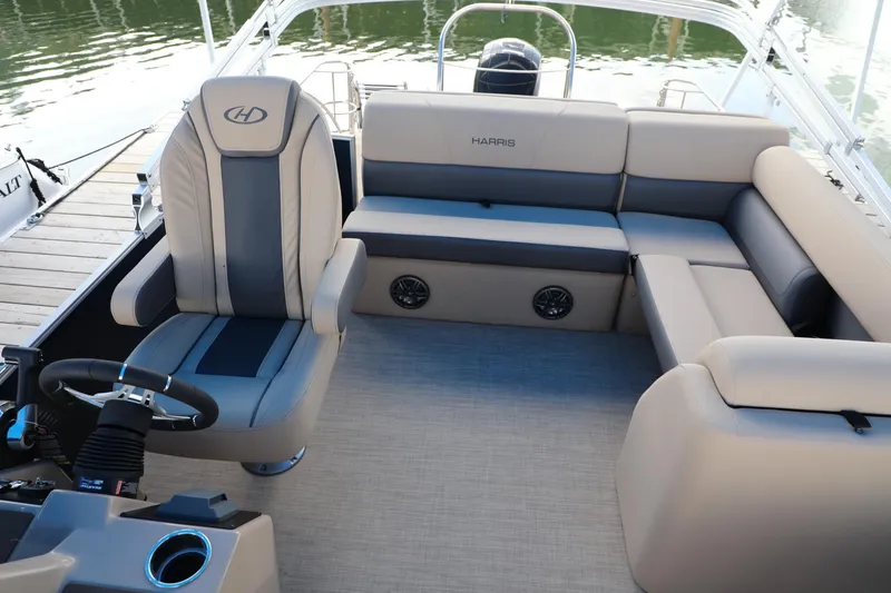 Slide: The Image of 2023 Harris Cruiser 230 boat interior with plush seating and modern design. - 6