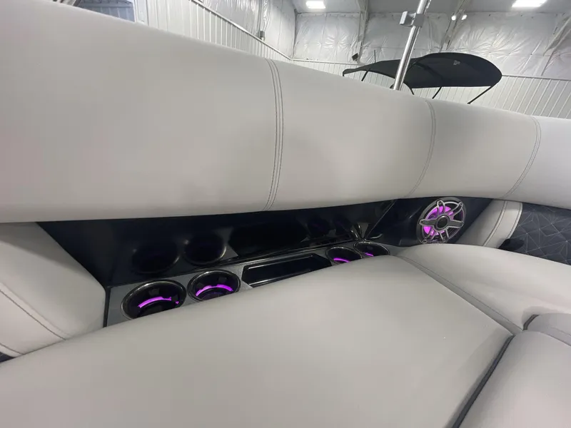 Slide: The Image of Luxurious interior of 2023 Harris Grand Mariner 250 with illuminated cup holders and speaker. - 15