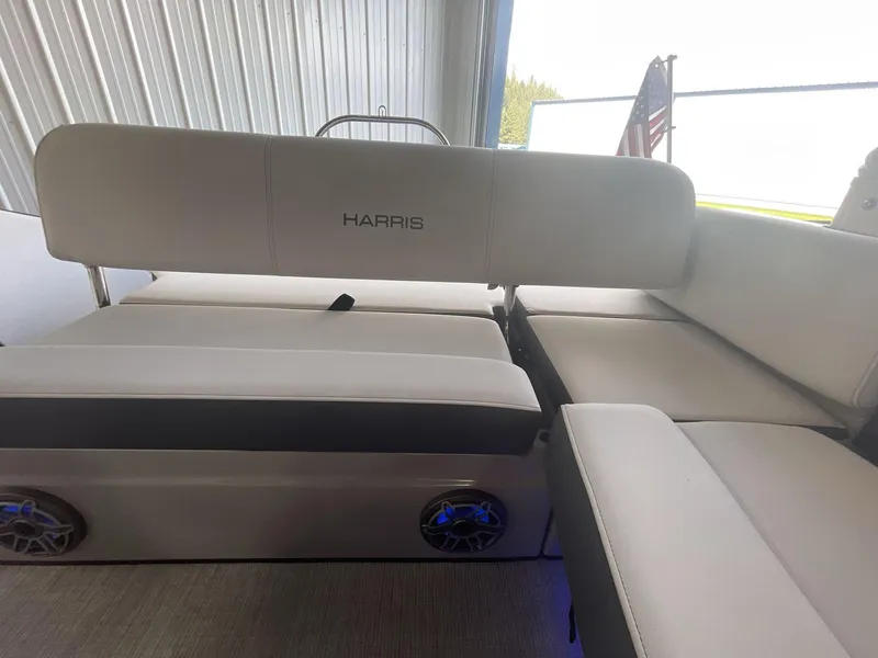 Slide: The Image of 2023 Harris Grand Mariner 250 boat interior with plush seating and integrated speakers. - 16