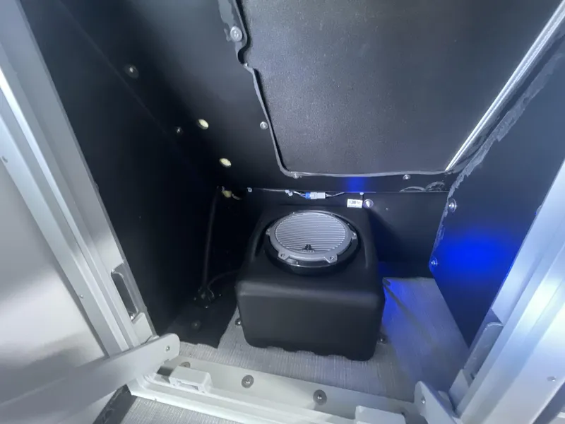 Slide: The Image of Interior of 2023 Harris Grand Mariner 250 boat with speaker and blue lighting. - 18