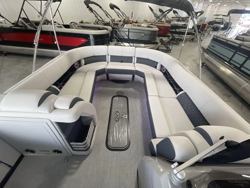 Slide: The Image of 2023 Harris Grand Mariner 250 pontoon boat interior with spacious seating and modern design. - 19