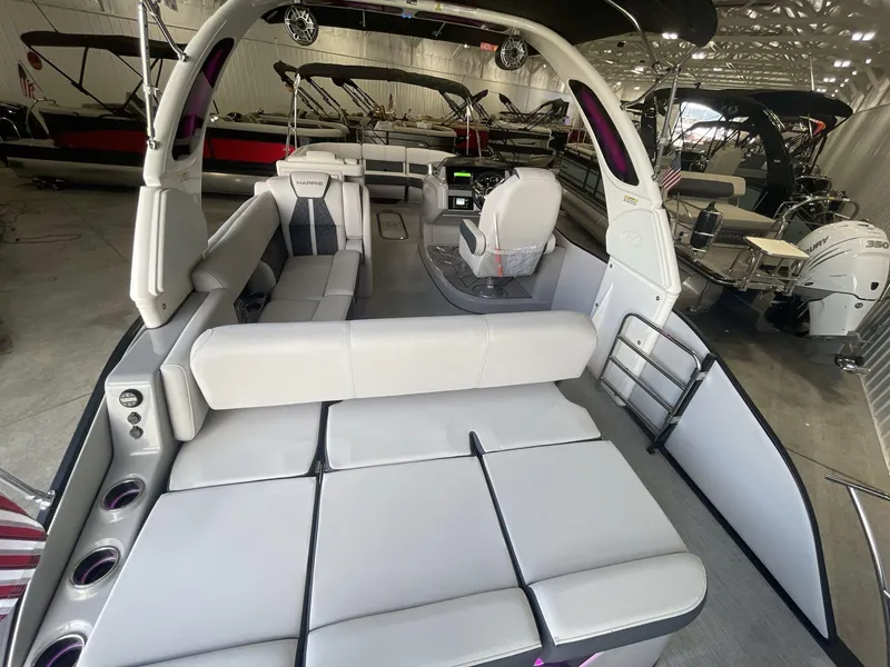 Slide: The Image of 2023 Harris Grand Mariner 250 pontoon boat interior with spacious seating and modern design. - 7