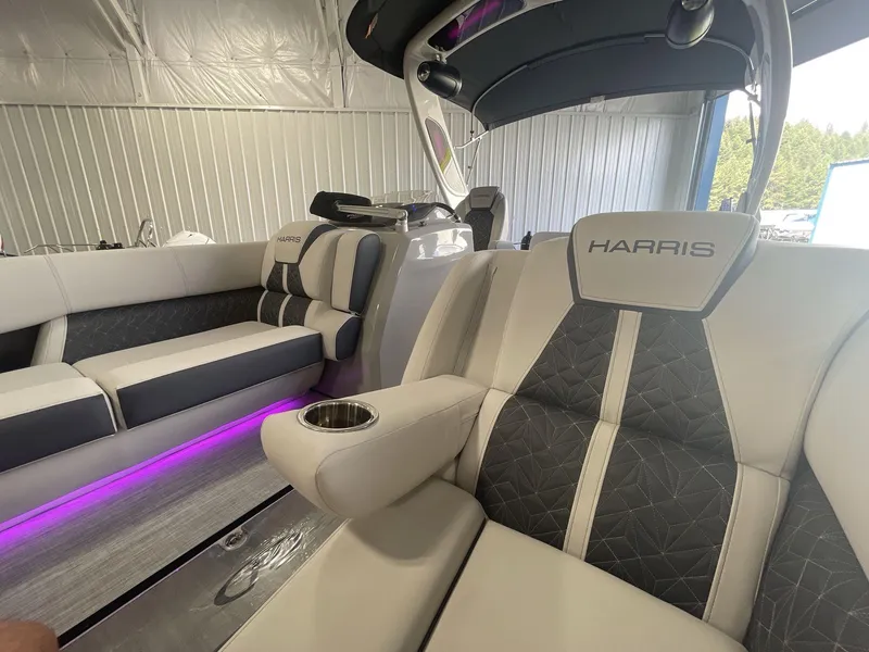 Slide: The Image of 2023 Harris Grand Mariner 250 interior with luxurious seating and ambient lighting. - 9