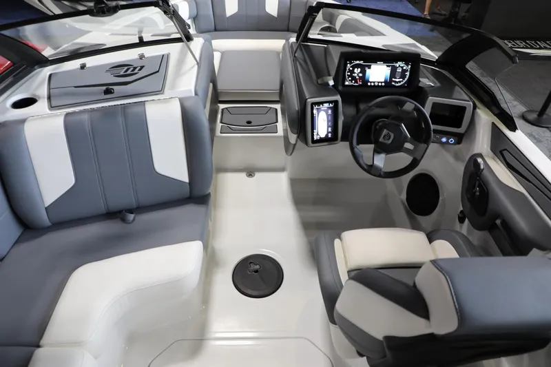 Slide: The Image of 2024 Malibu 21 LX-R boat interior with modern dashboard and seating. - 10