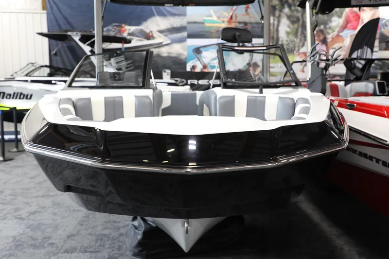 Slide: The Image of 2024 Malibu 21 LX-R boat displayed indoors, showcasing sleek design and modern features. - 4